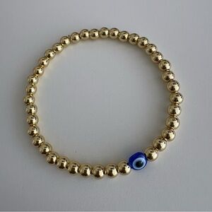 Gold Beaded Bracelet with Blue Evil Eye Bead